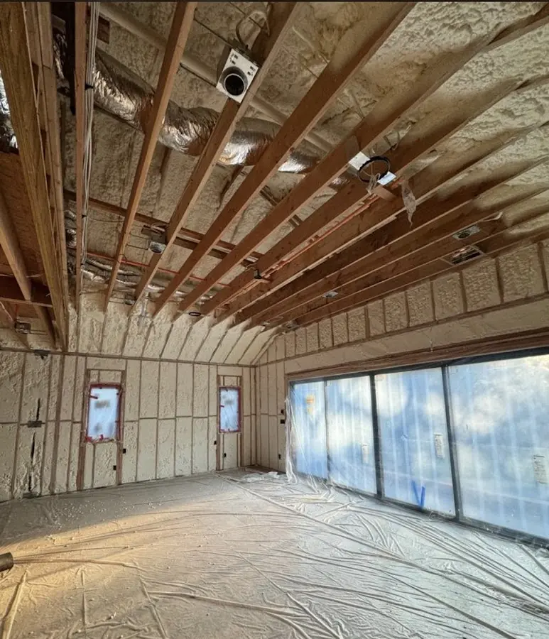 Interior walls and ceiling insulated with spray foam during new construction in Dowagiac